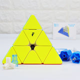 A yellow Forg3d WeiLong Modded Pyraminx puzzle with a custom duo-tone colored core, purple & blue, along with purple magnet capsules. The image also shows blue and white tip washers, and the product packaging in the background.